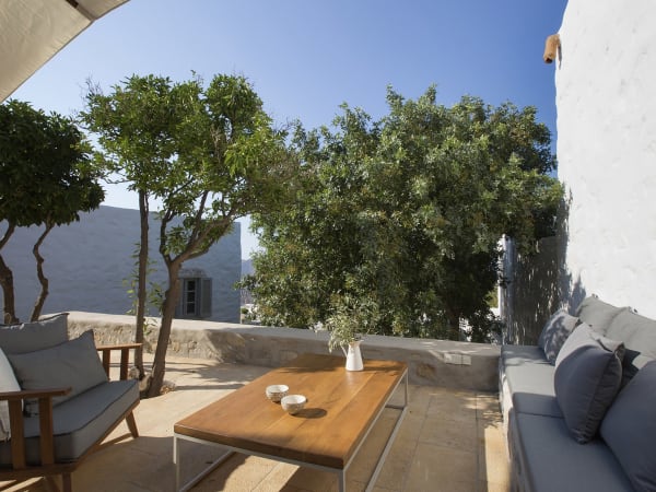 A sitting area on the sheltered, walled terrace outside the kitchen.